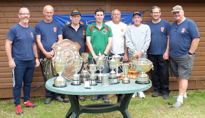 Rugeley members standing behind a table of silverware at the 2019 Staffordshire County Championship