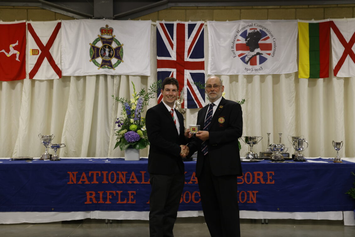 Richard Hemingway receiving a badge at the prizegiving of the 2023 NSRA National Meeting at Bisley.