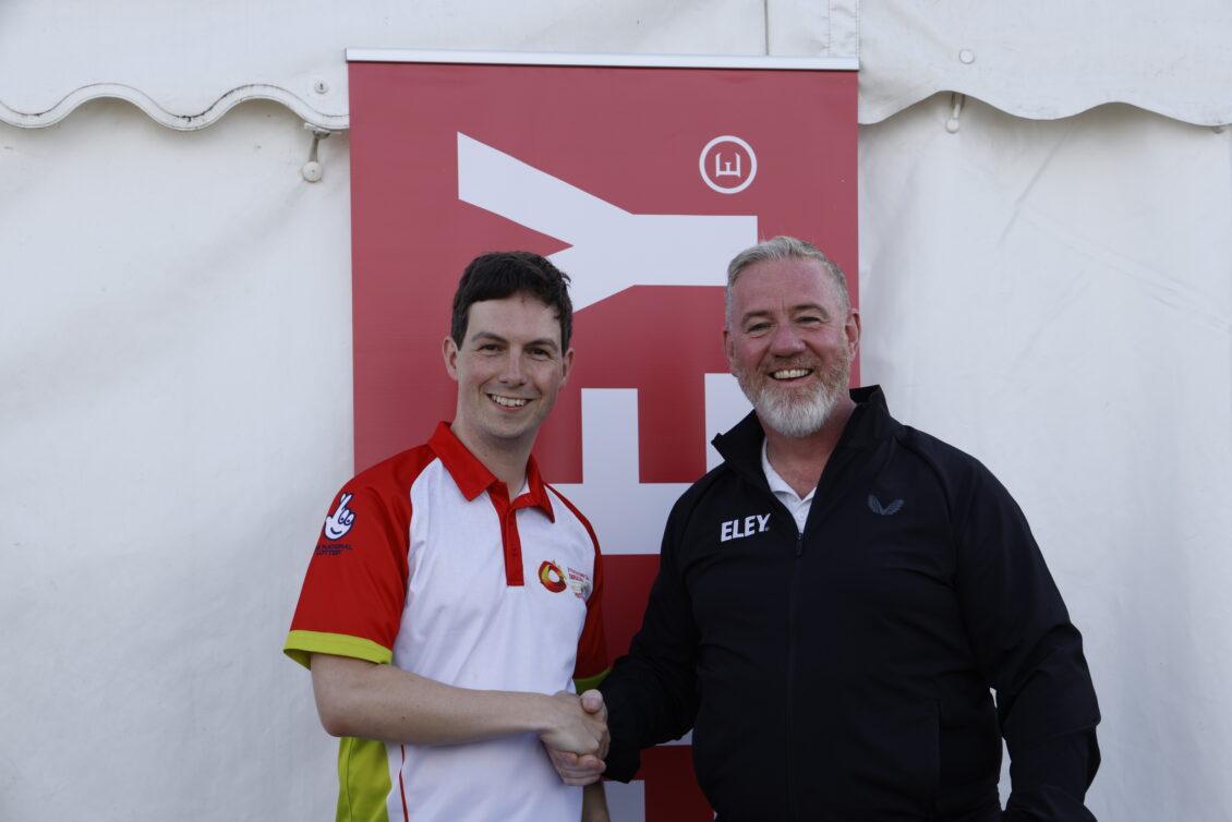 A competitor receiving his prize from Martyn Buttery, Eley Sports Marketing and Test Range manager.